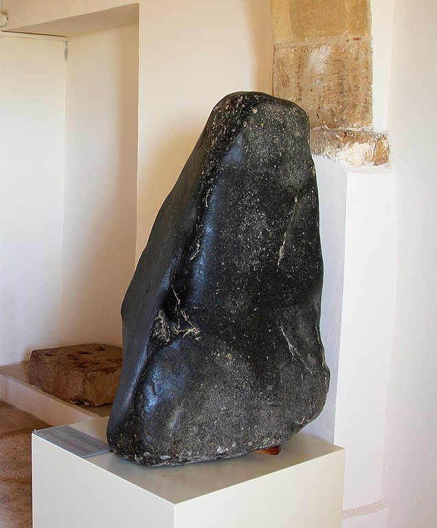 Conical stone which served as the cult idol in the sanctuary of Aphrodite at Palaepafos, Cyprus - Wojciech Biegun, CC BY-SA 3.0, via Wikimedia Commons.