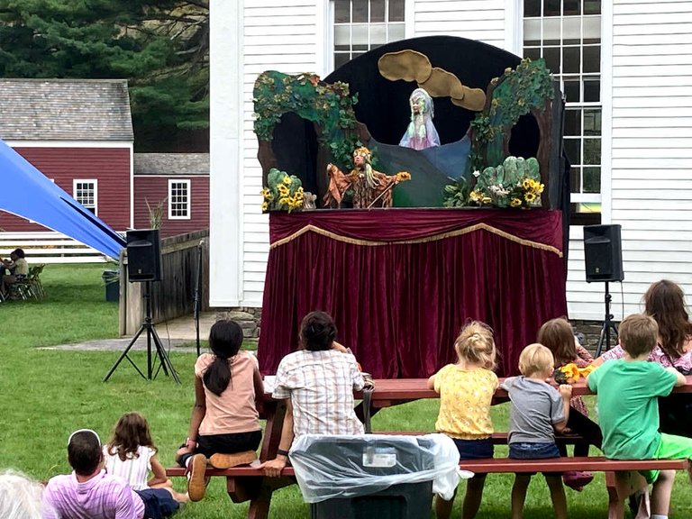 The puppeteers were excellent, as was the artisanship of the puppets. In the background is an old church building.