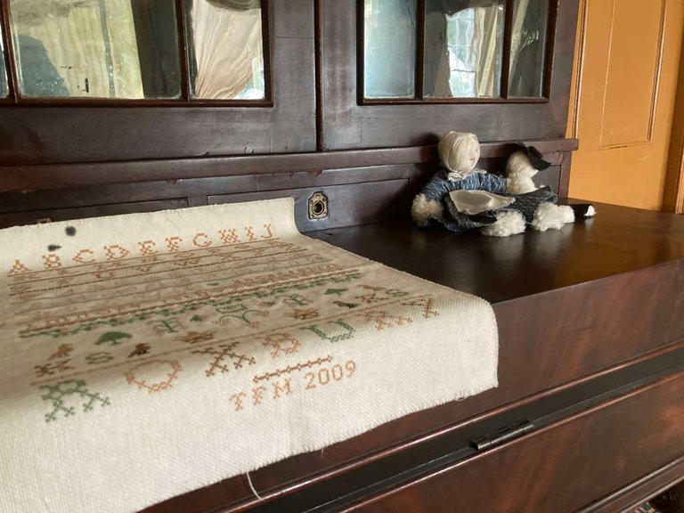 Visitors can walk in to any of the buildings in the reconstructed 19th century village. Here is a detail of some items inside a book case in one of the family houses, which was an actual home of a slightly famous local family.