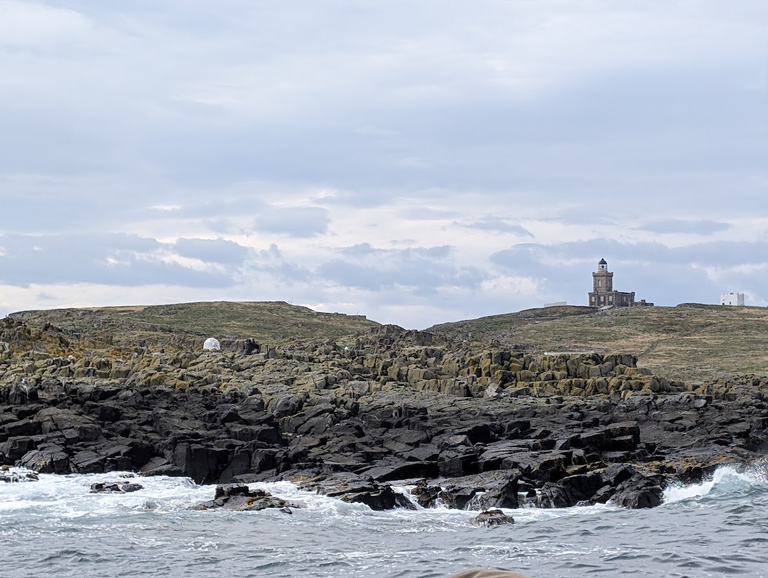 Multiple colour areas from sea on the Isle of May