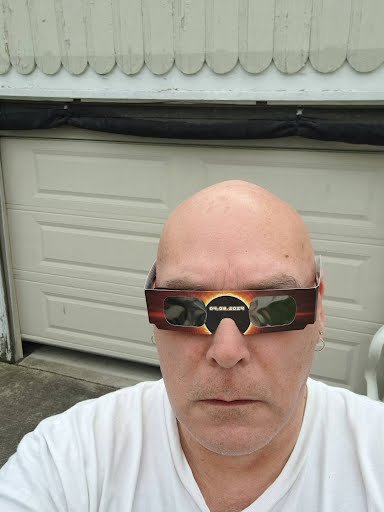 A little gruffy! Trying out my eclipse glasses.