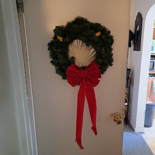 Slapped the wreath my cousin made me on the door. Happy Holidays