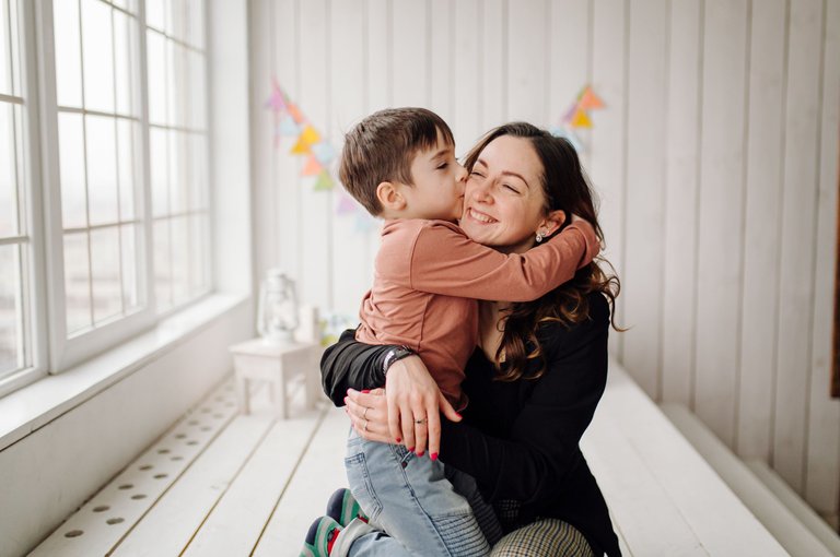 mother-her-son-are-posing-studio-wearing-casual-clothes.jpg