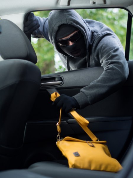 depositphotos_78746052-Transportation-crime-concept-.Thief-stealing-bag-from-the-car.jpg