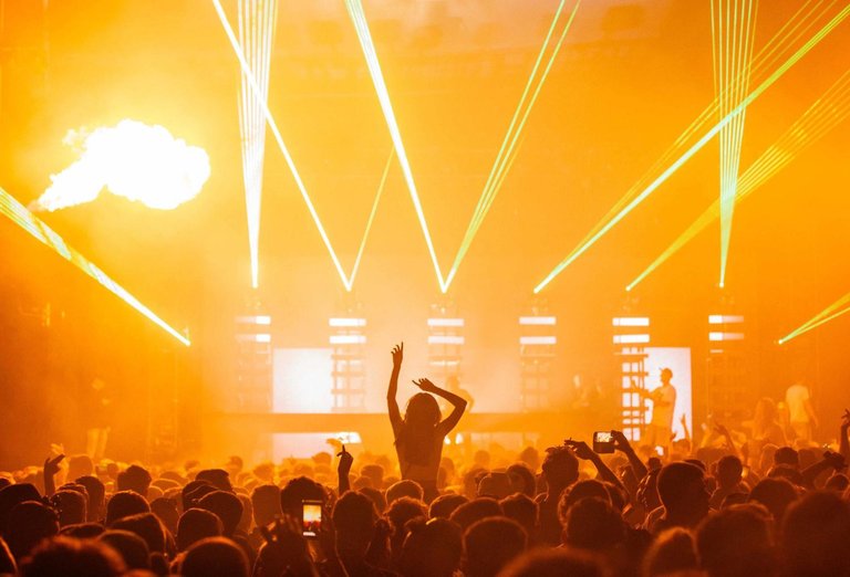 beautiful-shot-live-concert-performance-with-yellow-light-show-big-crowd-cheering.jpg