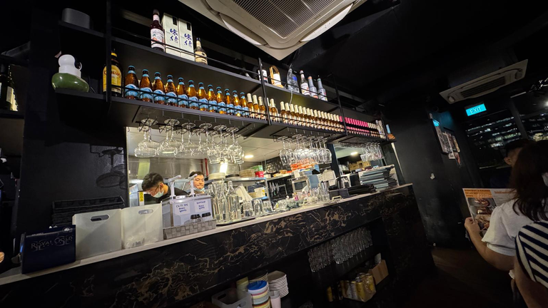 Mini bar region within the bistro with loads of alcohol on display