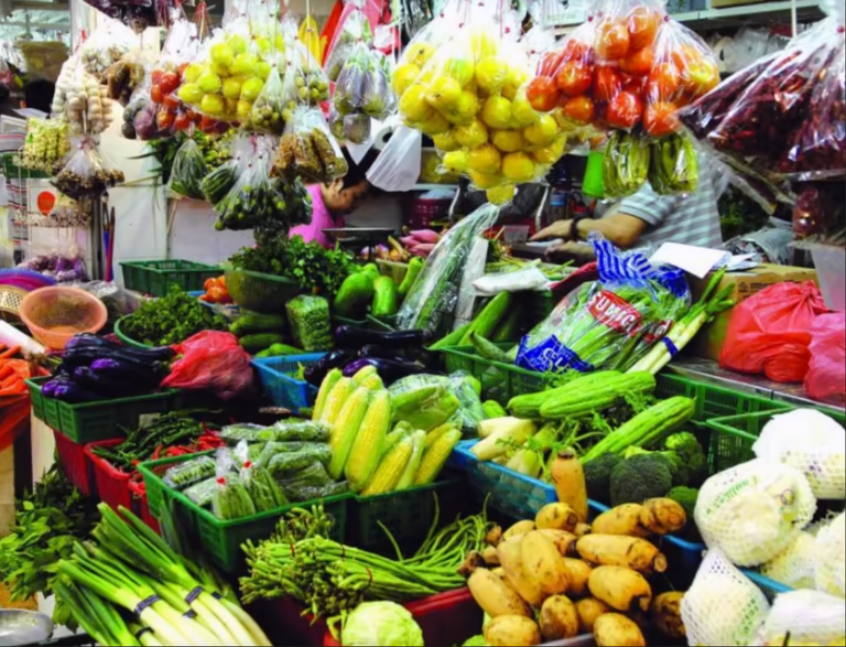 Singapore Wet Market Selling Vegetables with Scary Egg Plant on the Left