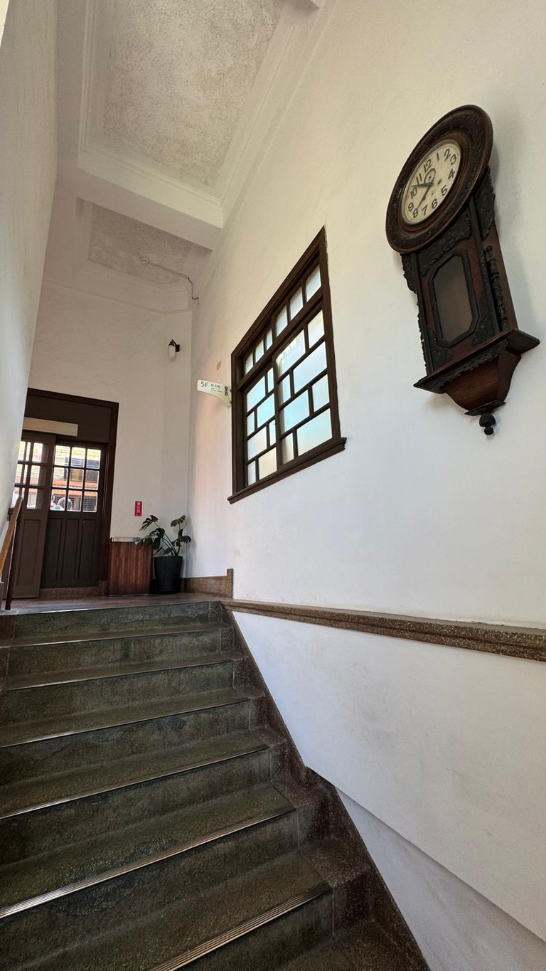 Stairwell that connect each level and filled with antiques for decoration