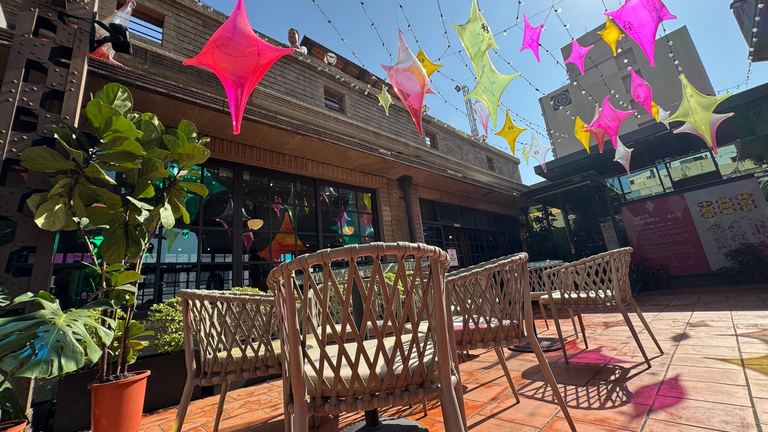 Outdoor seating outside eatery at top level