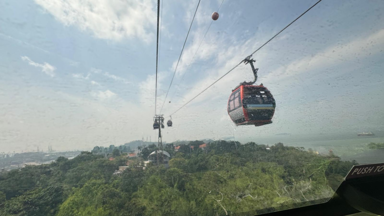 Photo shot from inside the cable car through cable car glass panel