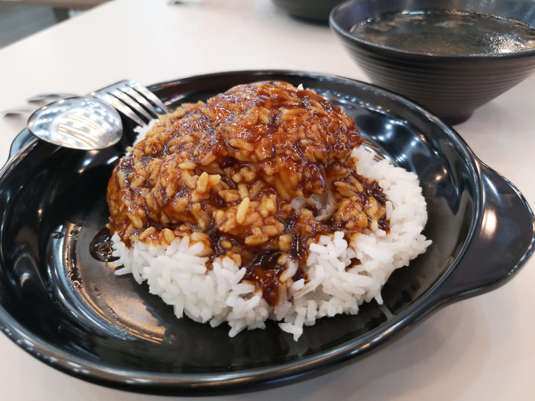 Nice portion of rice immersed in braised sauce