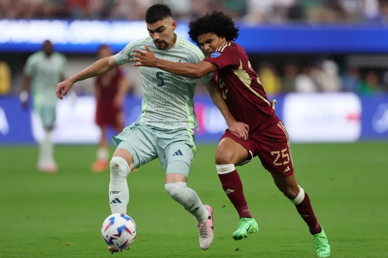 inglewood-california-june-26-johan-vasquez-of-mexico-battles-for-possession-with-eduard-bello-of-venezuela-during-the-copa-america-2024-group-b-match-between-venezuela-and-mexico-at-sofi-stadium-on-june-26-202.webp