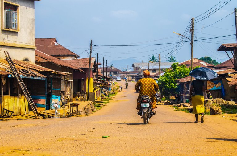 free-photo-of-man-riding-motorbike-in-village.jpeg