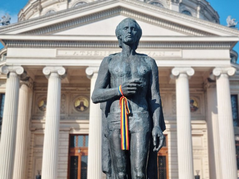 Romanian Poet Mihai Eminescu (Statue in front of the Athenaeum in Bucharest). AI-generated song channel with poems of Eminescu discovered?