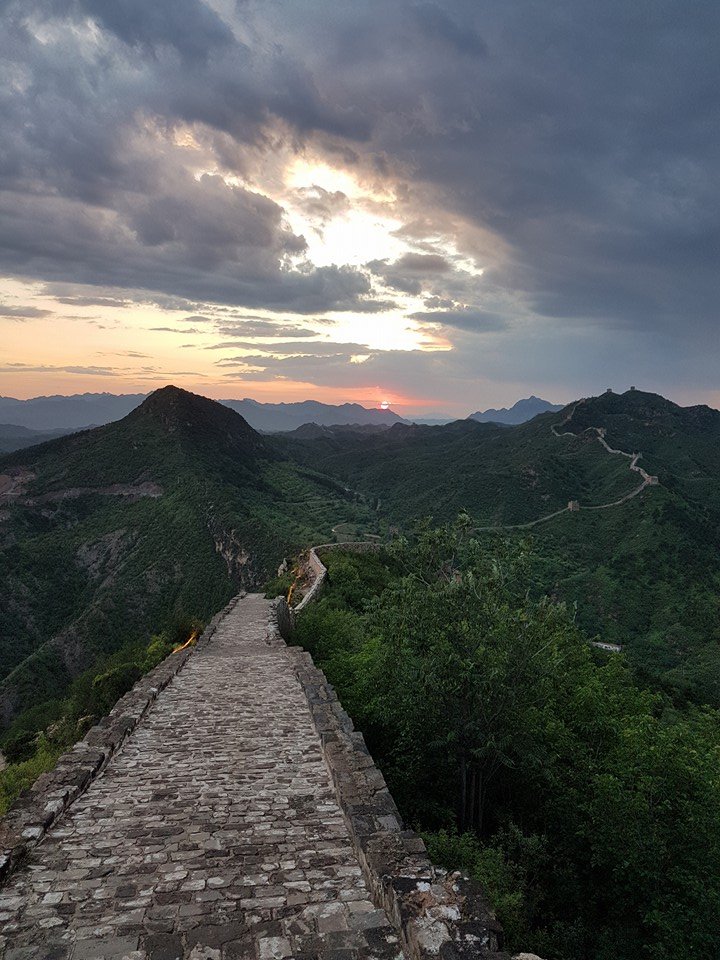 Sunset over the great wall of china.jpg