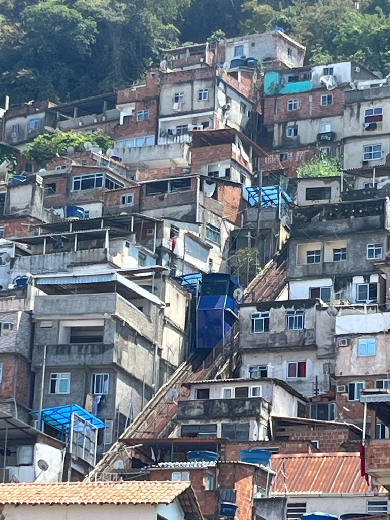 that blue thing is the trolly. the other little blue things are water barrels, or tarps. 