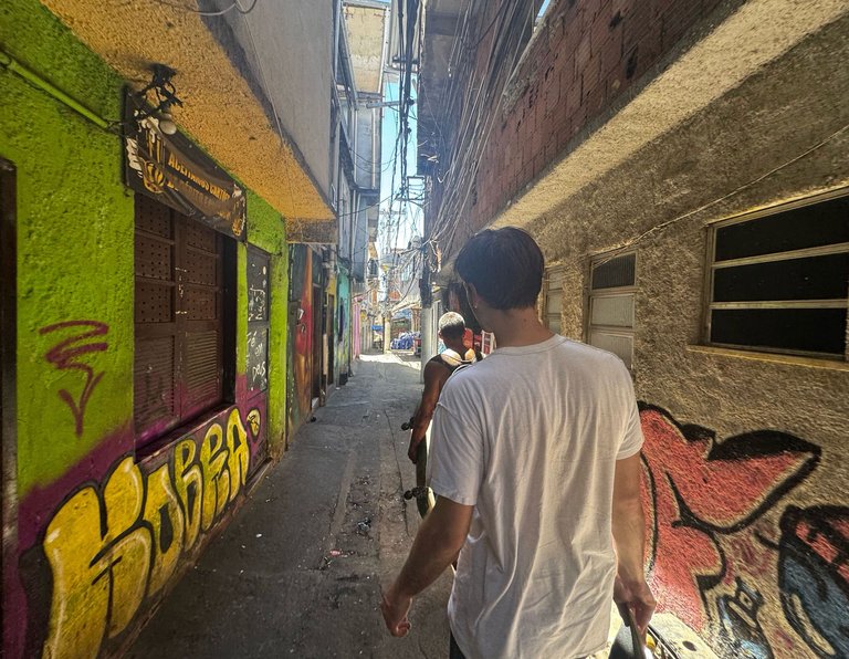 Pharra leads us into the depths of the favela towards the skatepark