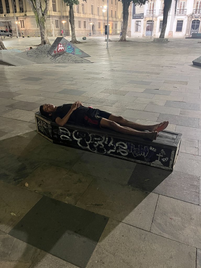 i went skating alone one night and this guy was sleeping on the coffin 
