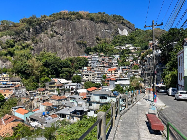 Pharra and his team turned that sidewalk into something accecable for pedestrians again, by cleaning it up and adding those cement benches, before it was all parked cars.