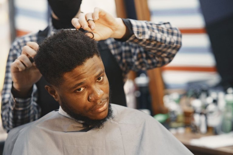 young-african-american-man-visiting-barbershop.jpg