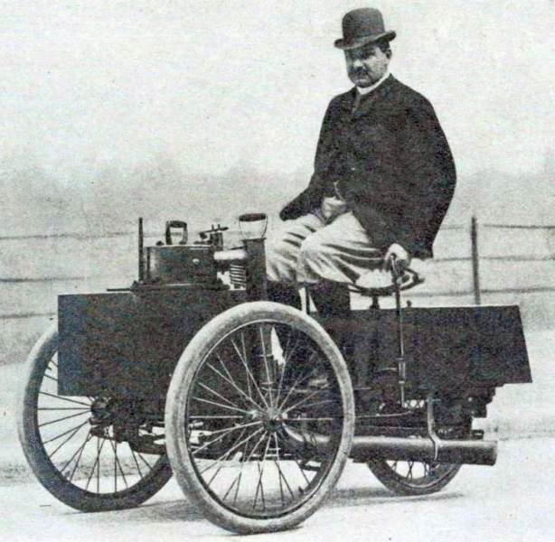 De Dion sitting on his Steam tricycle - Source