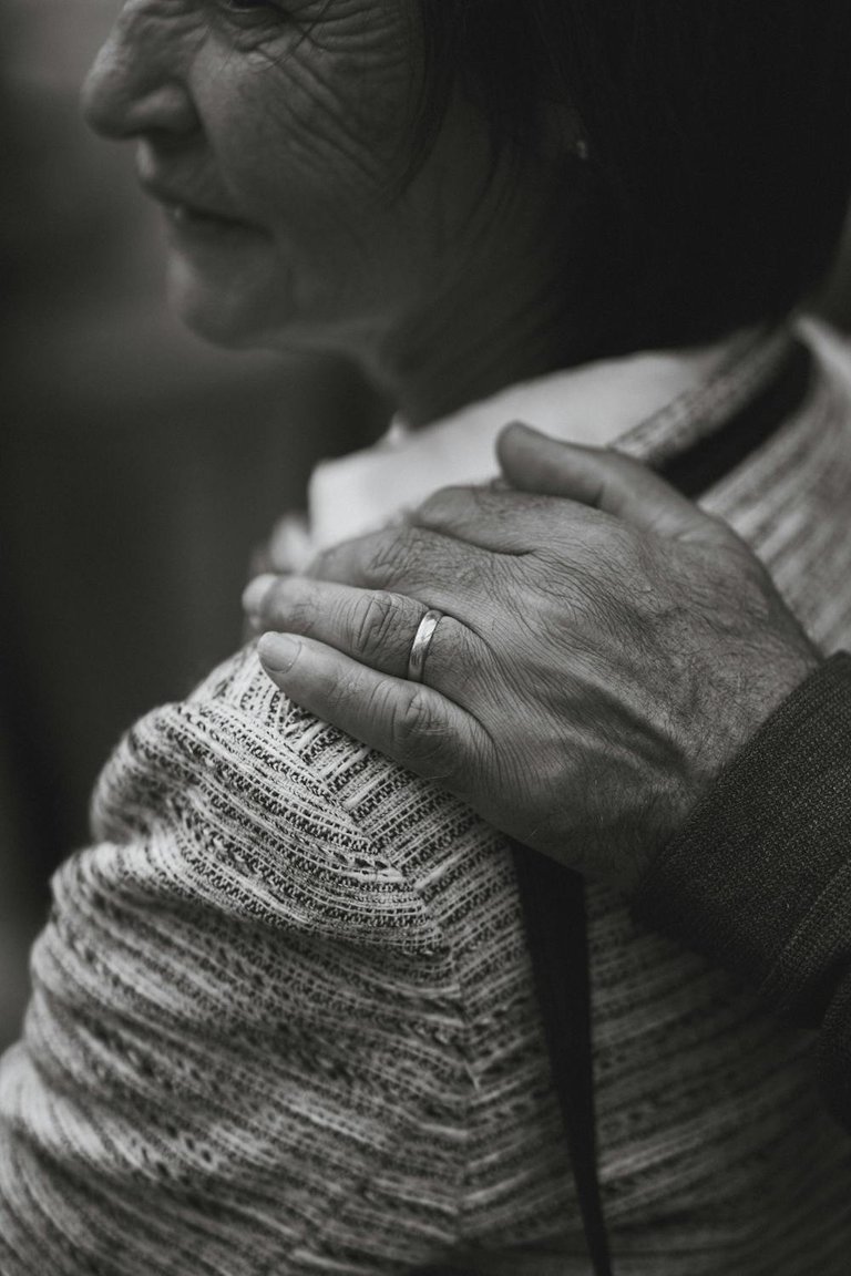 free-photo-of-mans-hand-on-shoulder-of-an-elderly-woman-in-black-and-white.jpeg