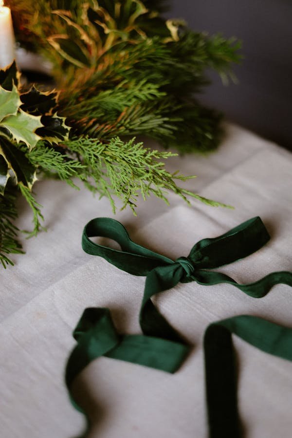 free-photo-of-festive-green-ribbon-with-evergreen-arrangement.jpeg