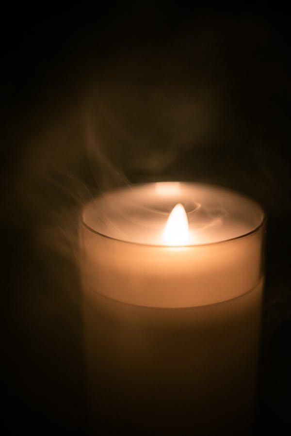 free-photo-of-warm-candlelight-and-rising-smoke-still-life.jpeg