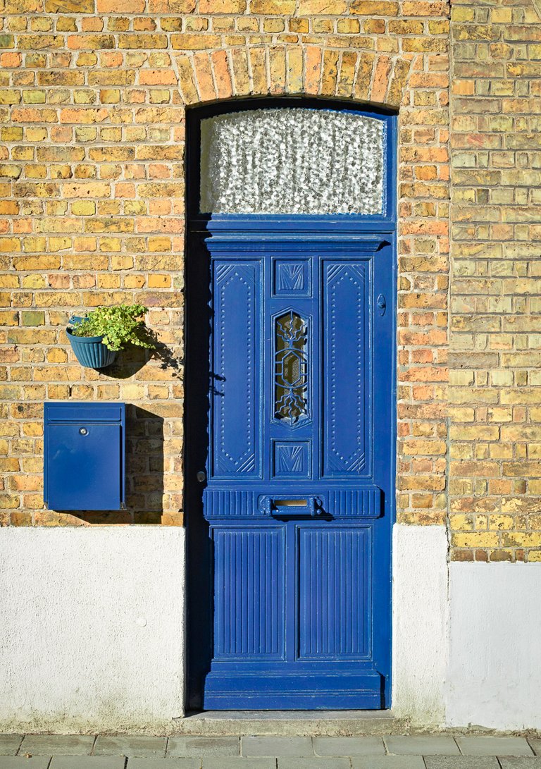 Blue door with blue mailbox