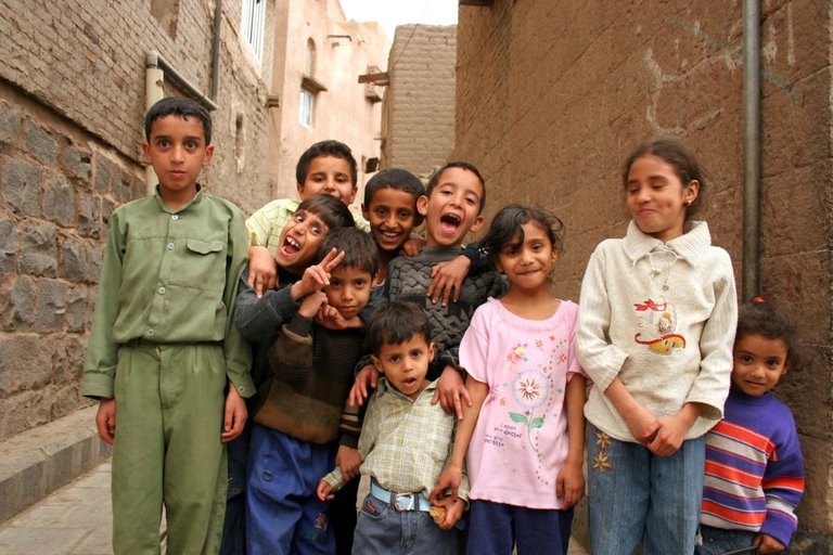 Group of children take funny picture in Taiz, Yemen