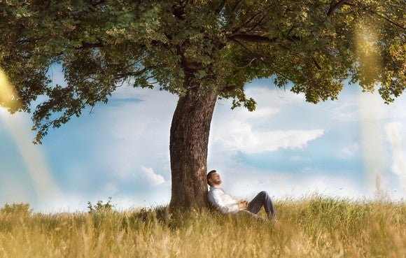 Man sitting under a tree
