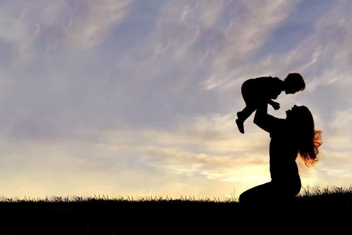 silhouette-of-happy-mother-playing-outside-with-baby.jpg