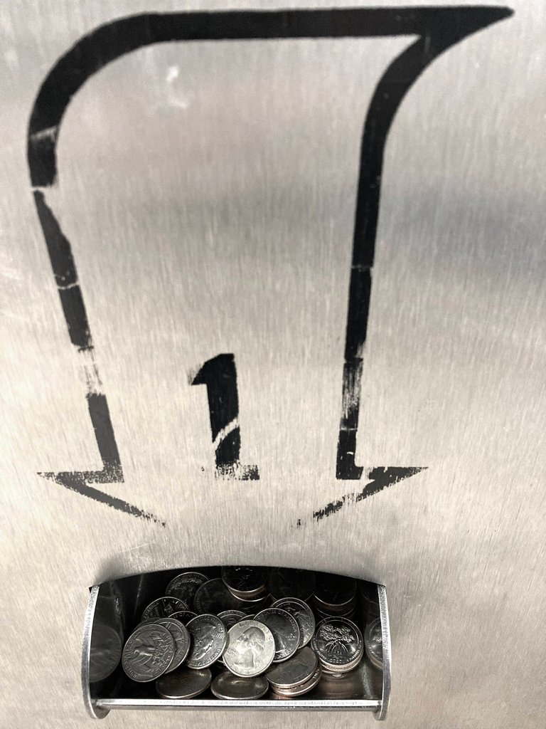 Public domain stock image of a coin dispenser