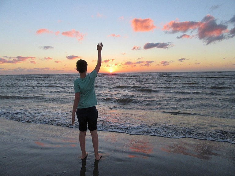 The boy waving goodbye