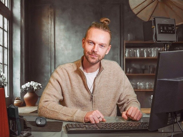 [Source] (https://pixabay.com/photos/man-desk-computer-adult-blond-pc-9216455/)