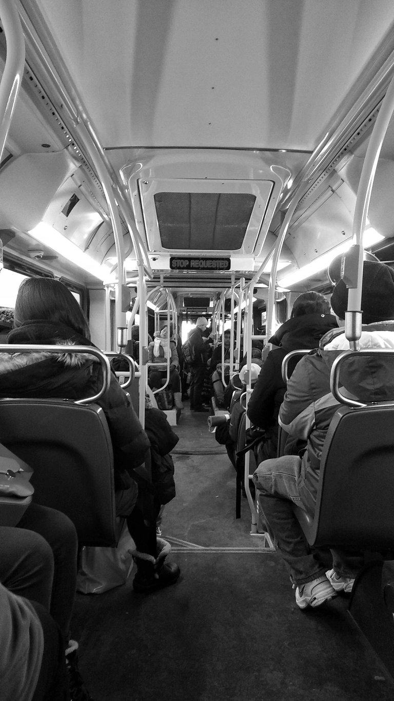 [source](https://unsplash.com/photos/a-black-and-white-photo-of-people-sitting-on-a-bus-Waefj7dxxEs)