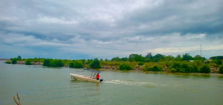 Tracing the boundaries of river and sea, Ulee Lheue fishermen paddle their hopes every morning.