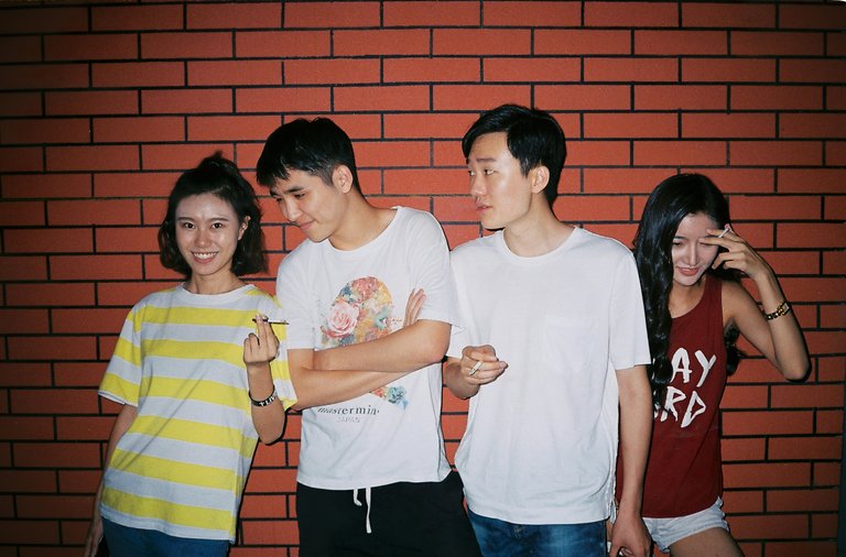 [Source](https://unsplash.com/photos/a-group-of-people-standing-together-oXpYufKQGWQ)