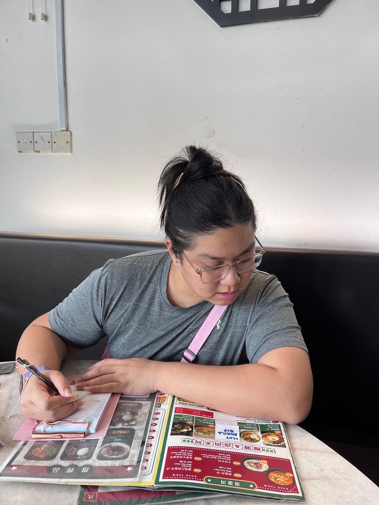 Lookine at the nicely designed menu. 