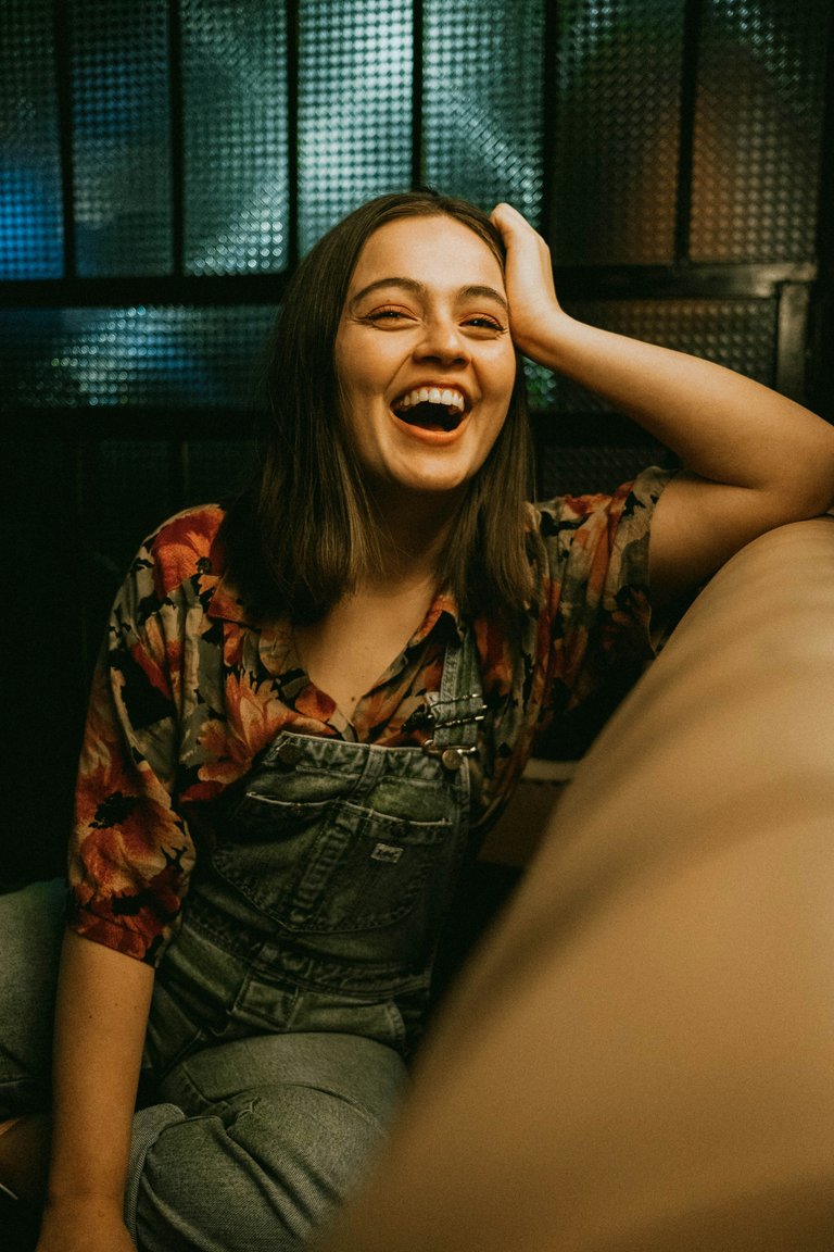 [Source](https://unsplash.com/photos/woman-in-brown-and-black-button-up-shirt-smiling-rEfbRIdvykc)