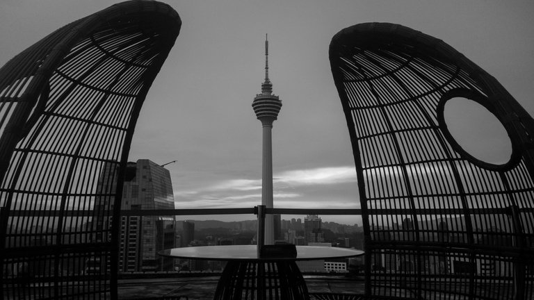 two_chairs_on_a_rooftop_at_sunset_1.jpg