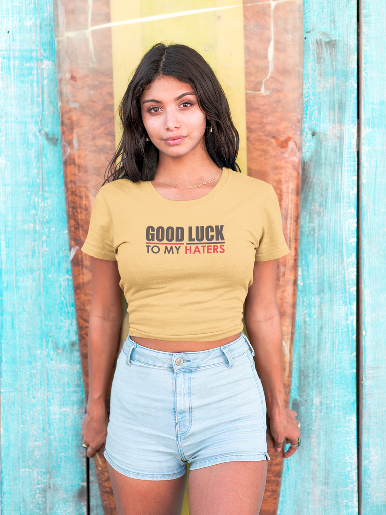 hispanic-girl-wearing-a-tshirt-mockup-standing-against-a-surfboard-a18806.png