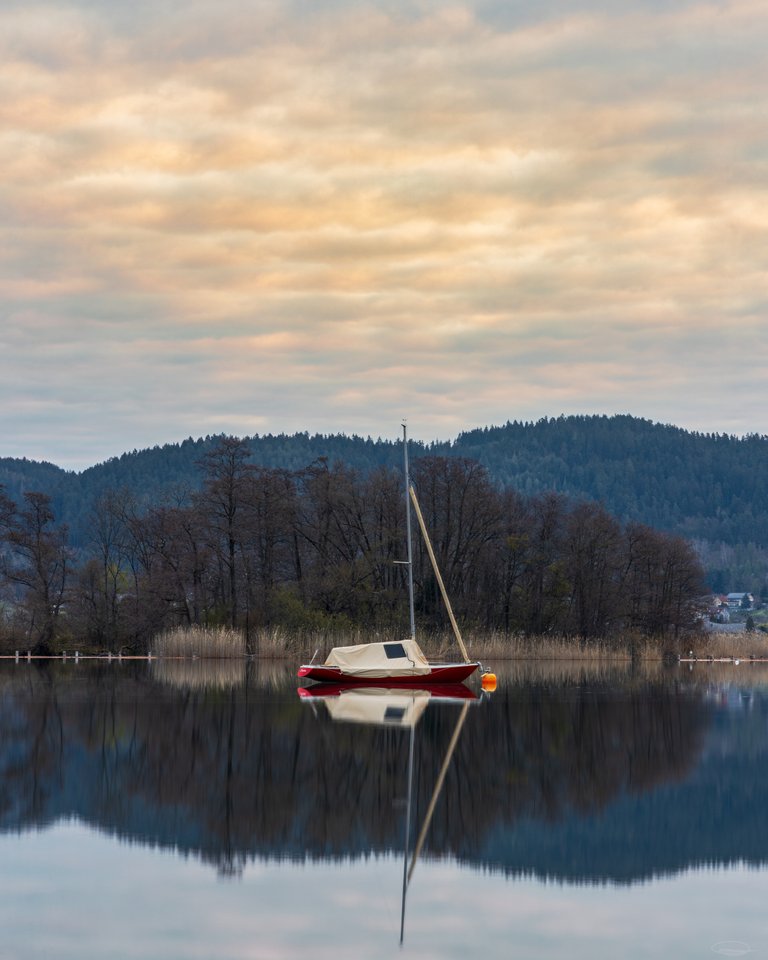 Calm Lake Woerthersee / Wörthersee on a cloudy Spring Morning