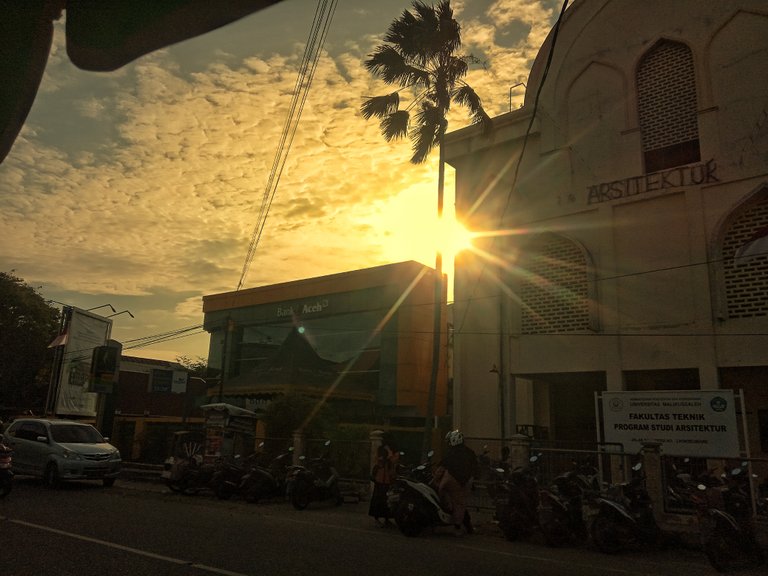 sunset in front of the malikussaleh university campus architecture