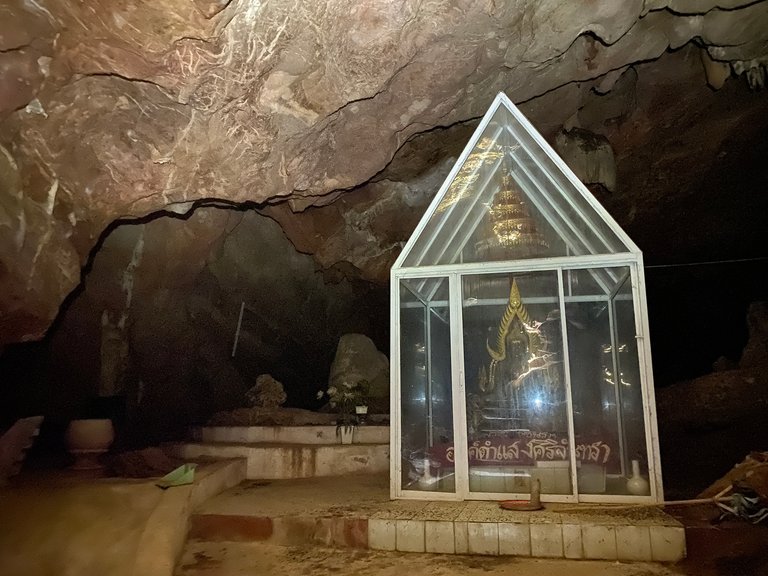 The cave's only Buddha well protected from bat droppings
