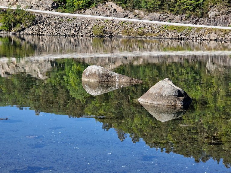 we were driving along the south coast to get to the southernmost point of land in Norway. the morning breeze was gentle so the water was quite smooth but not perfectly so. this is often the case and the wind picks up as the sun gets higher and warmer. there was a small rest area along the scenic road so we pulled over for a quick stop
