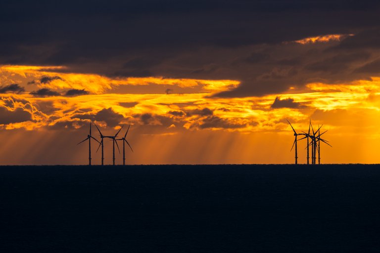 Shot of the Rampion Wind Farm at sunset