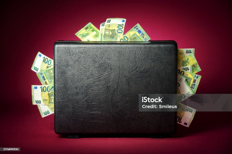 [Source](https://www.istockphoto.com/en/photo/concept-shot-of-a-briefcase-overflowing-with-euro-banknotes-gm2176890934-596352503)