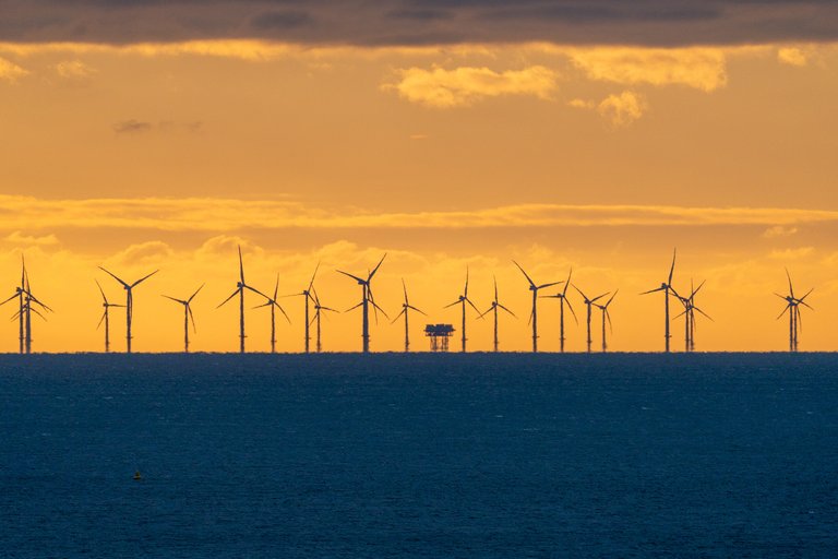 Shot of the Rampion Wind Farm and Substation at sunset