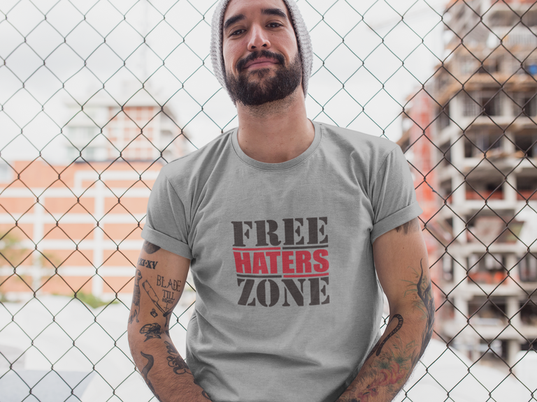 hipster-middle-aged-man-wearing-a-round-neck-tee-mockup-while-lying-against-a-fence-a17020.png